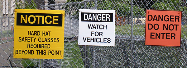 Collection of caution and construction signs on campus