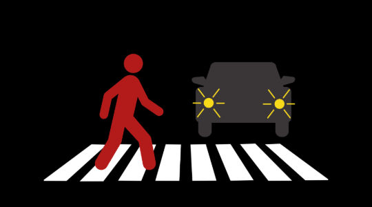 graphic of person walking across a cross walk at night